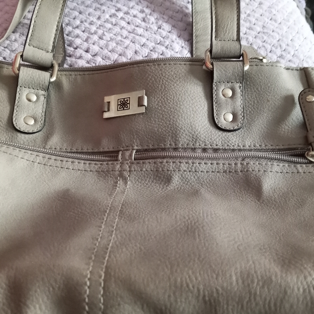 I believe this is a Calvin Klein purse